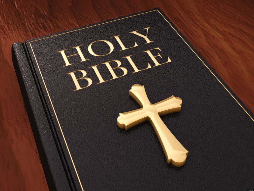 Golden cross and black leather bible