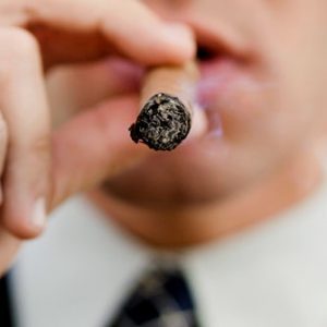 getty_rf_photo_of_man_smoking_cigar